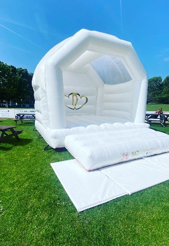 White wedding bouncy castle at The Oaks, Eltham Town, London supplied by S&T Wedding & Event Hire