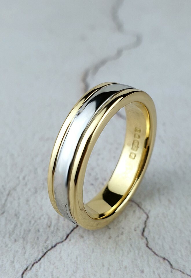 Handmade platinum and yellow gold wedding band