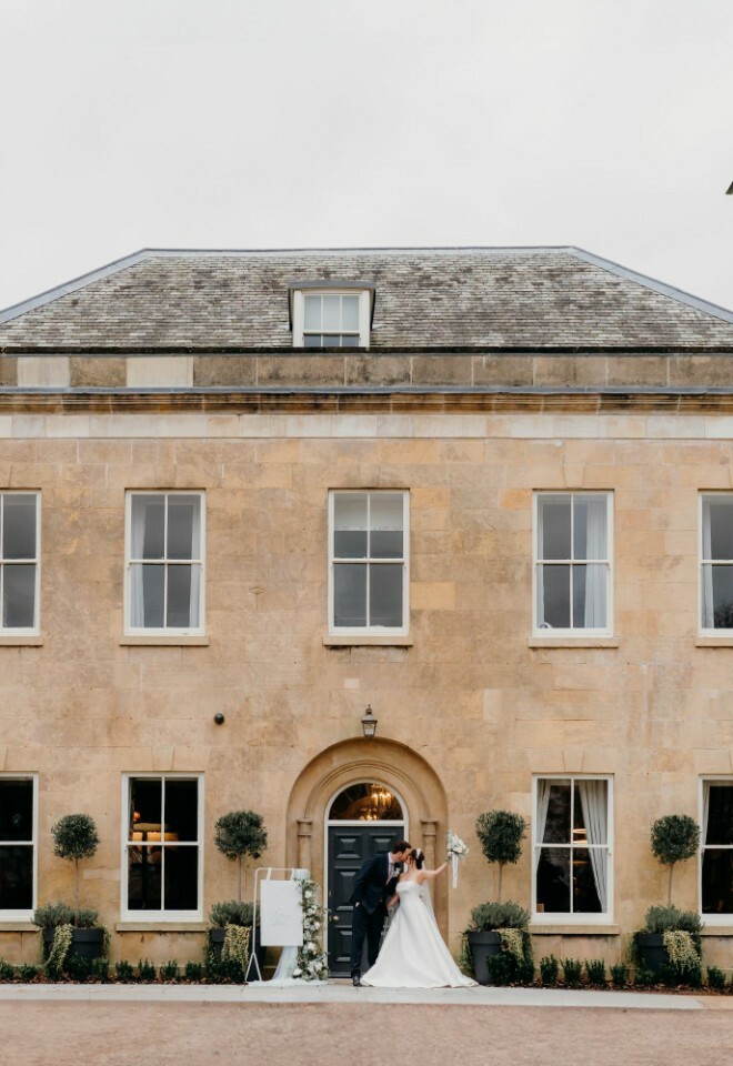 Bride and Groom outside Cuckney House