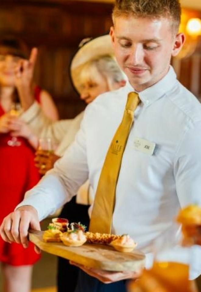 Canapes being served to wedding guests by a member of staff in the Suffolk Suite- Sprowston Manor Norwich