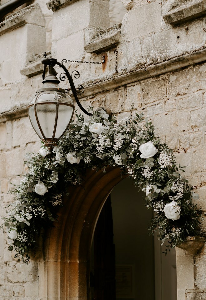 Door Arch with white floral garland above