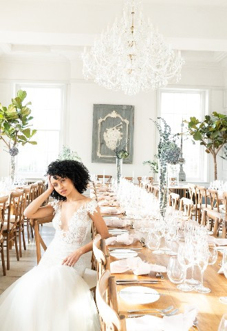 Bride sat at long tables
