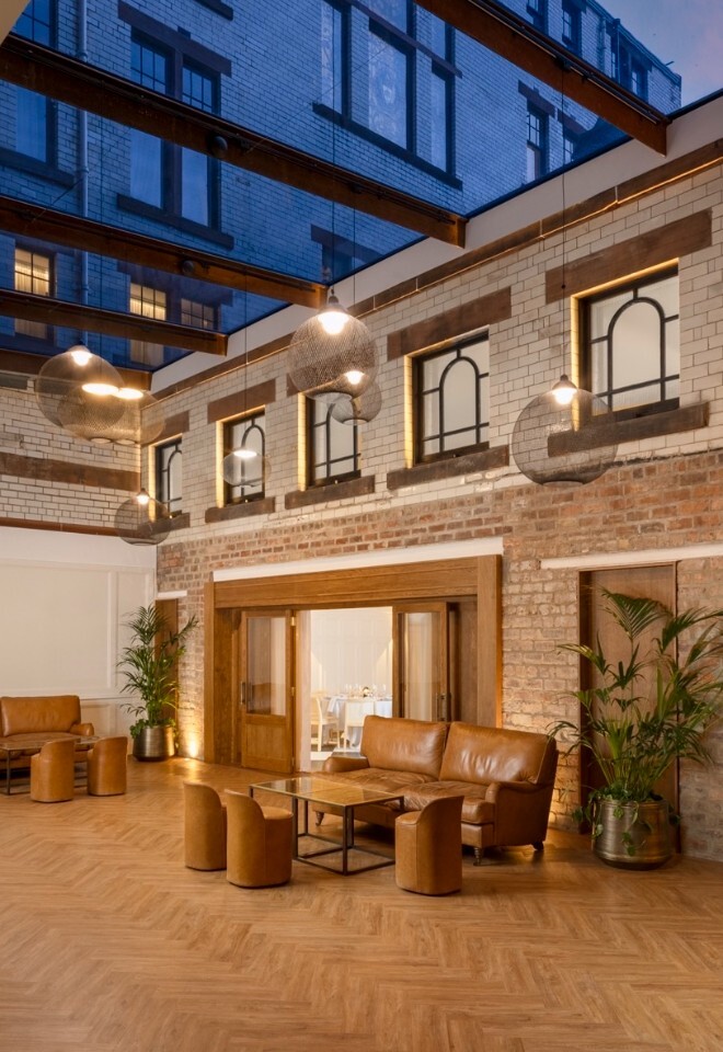 The Courtyard at The Collector’s Hall wedding venue in Glasgow with glass canopy and indoor-outdoor reception space