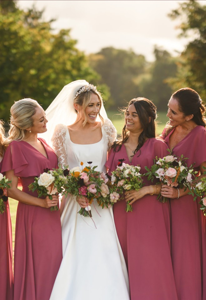Bride and bridesmaids bouquets of rich autumn flowers and foliage at North Mymms Park