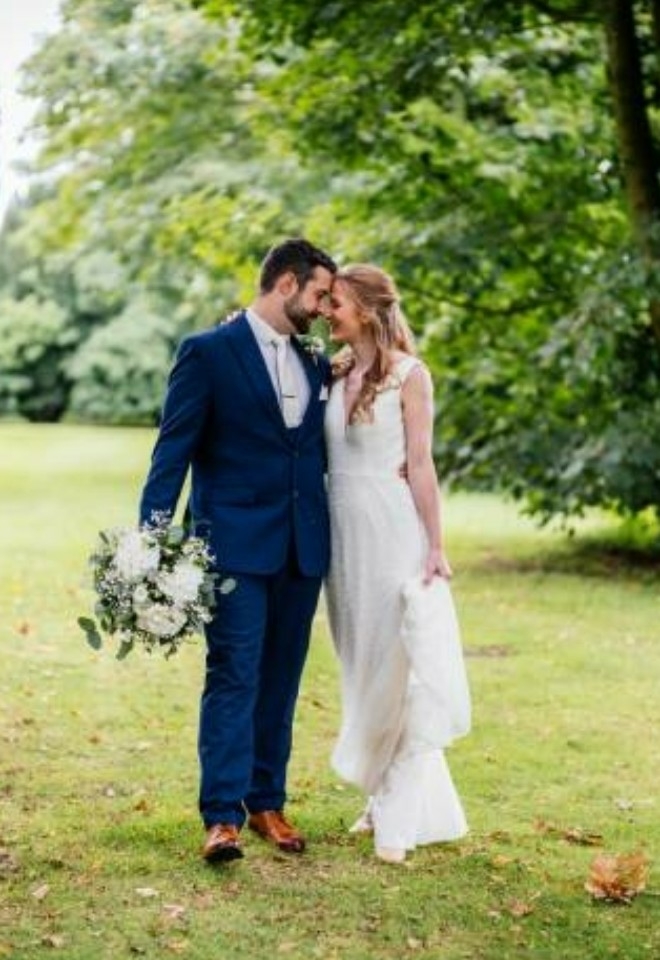 Couple walking together through the woodlands- Sprowston Manor Norwich