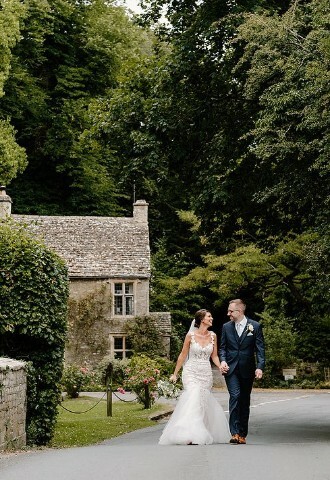 Couple on bridge outside Wild Thyme and Honey near Cirencester