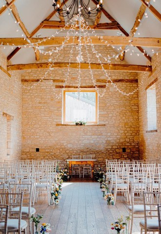 Wedding ceremony setting inside the Threshing Barn
