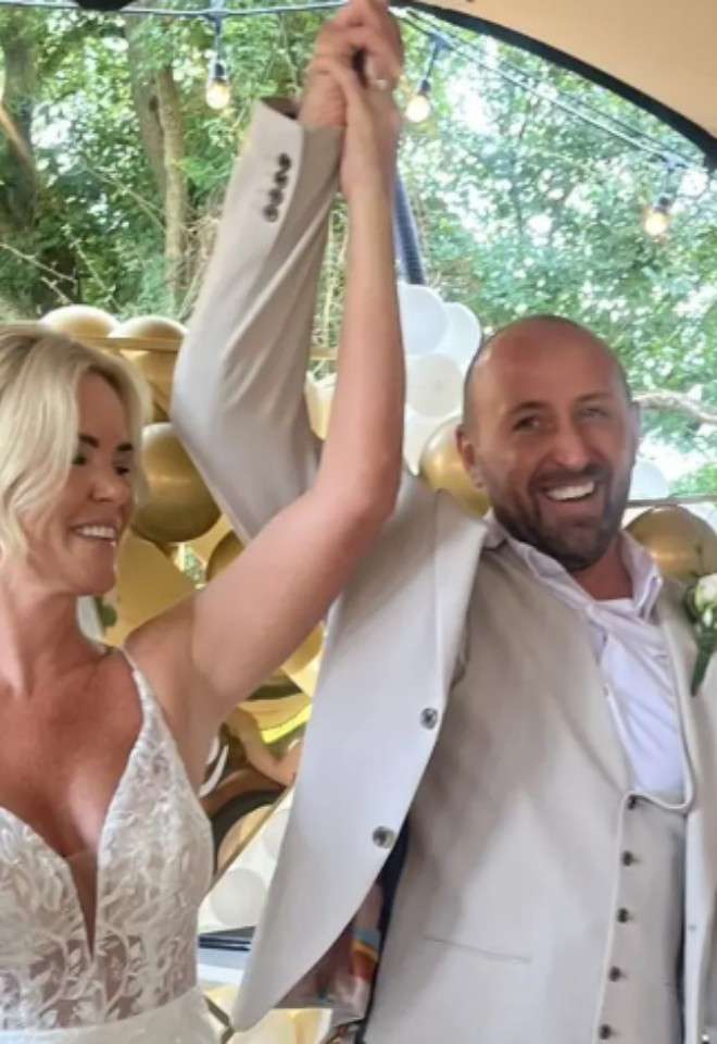 triumphant happy couple in an Essex wedding