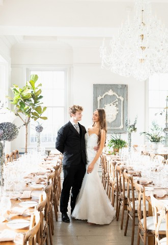 Bride and groom in wedding breakfast room