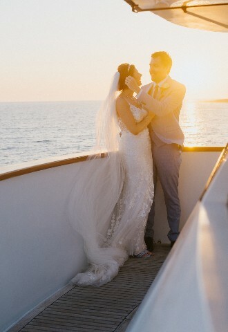 bride and groom posing for photographs at sunset in cyprus