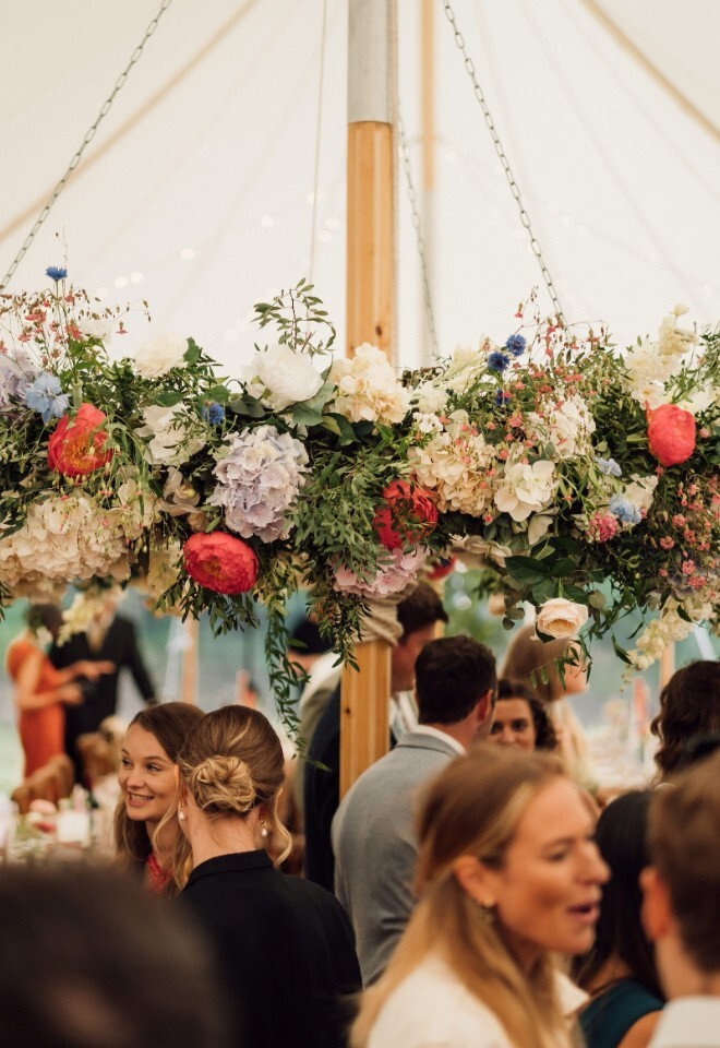 Floral arrangement in marquee wedding venue