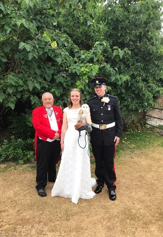 Owl ring bearer with bride & groom & Trevor English toastmaster in Hampshire