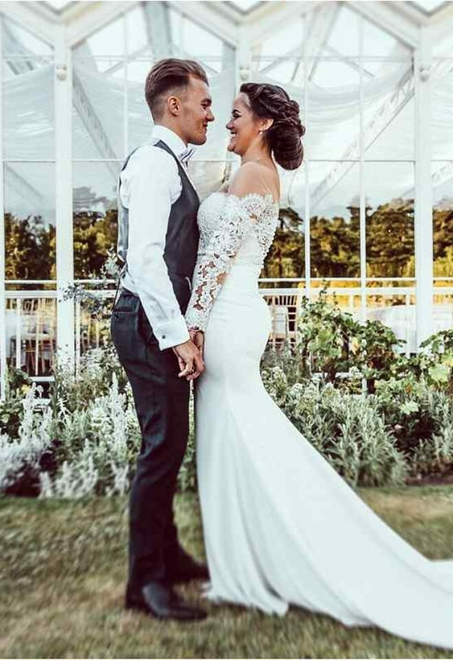 Bride and groom in front of the conservatory