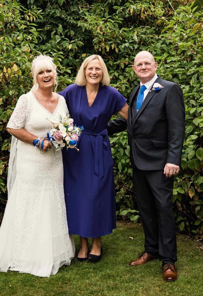 Helen with bride and groom after the ceremony