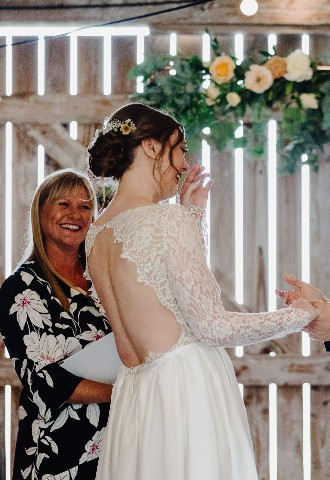 Celebrant Lisa with bride and groom at Trevibbin Mill