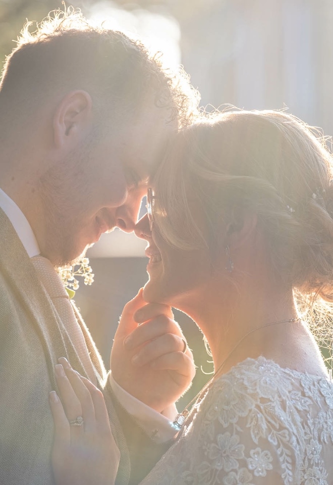 Bride & Groom having a moment together, backline by the late evening sun