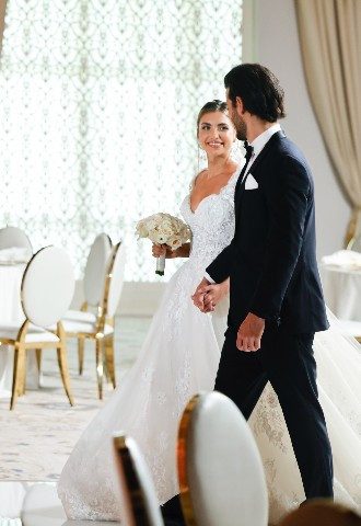 Bride and Groom walking through the Royale Ballroom at the Palace Downtown, Dubai