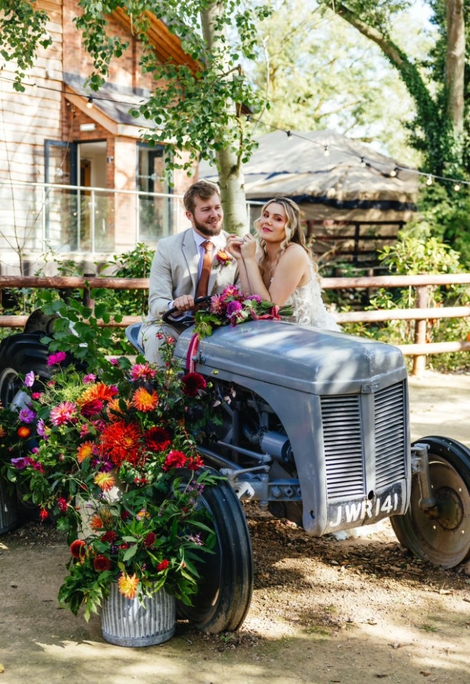 Bennetts willow barn affordable worcestershire wedding venue bride & groom on tractor