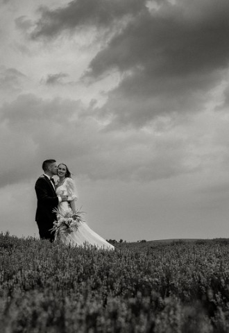 Wedding couple pose on Yorkshire Moors