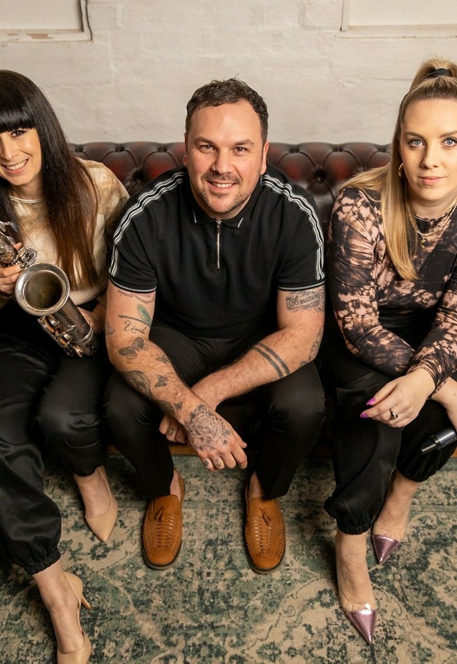 Kit, Josh & Nora sitting on a sofa