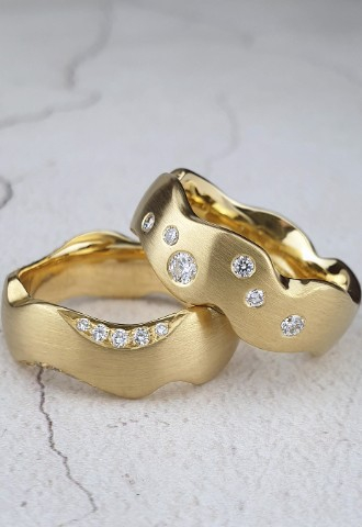 Bespoke hand-carved wedding rings with diamonds