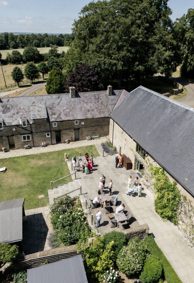 A view of the barn and grounds at an exclusive Oxfordshire wedding venue