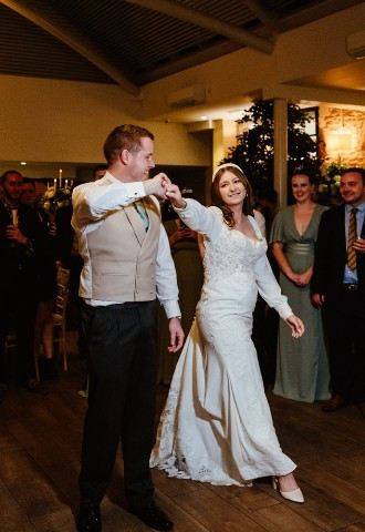 bride and groom sharing their first dance at voco Oxford Thames, Oxfordshire
