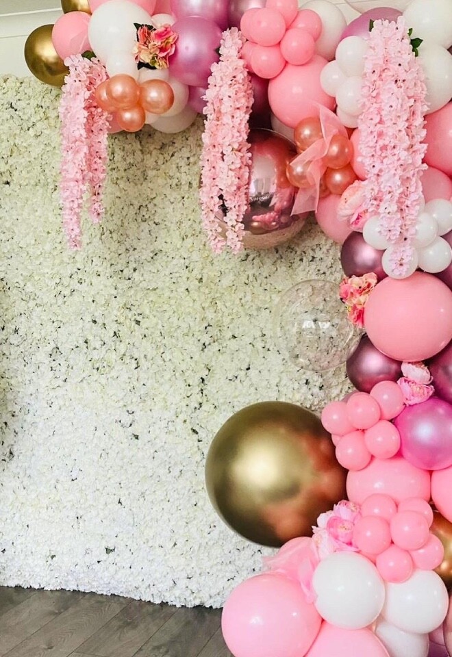 Pretty flower wall and balloon arch. 