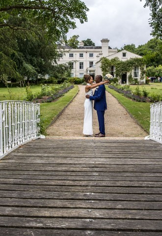 Wedding couple photo on bridge at Morden Hall South London