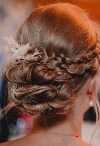 Wedding hair with braid and low bun updo