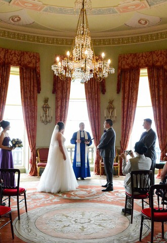 bride and groom at their wedding ceremony inside one of the function rooms at culzean castle wedding venue ayrshire scotland