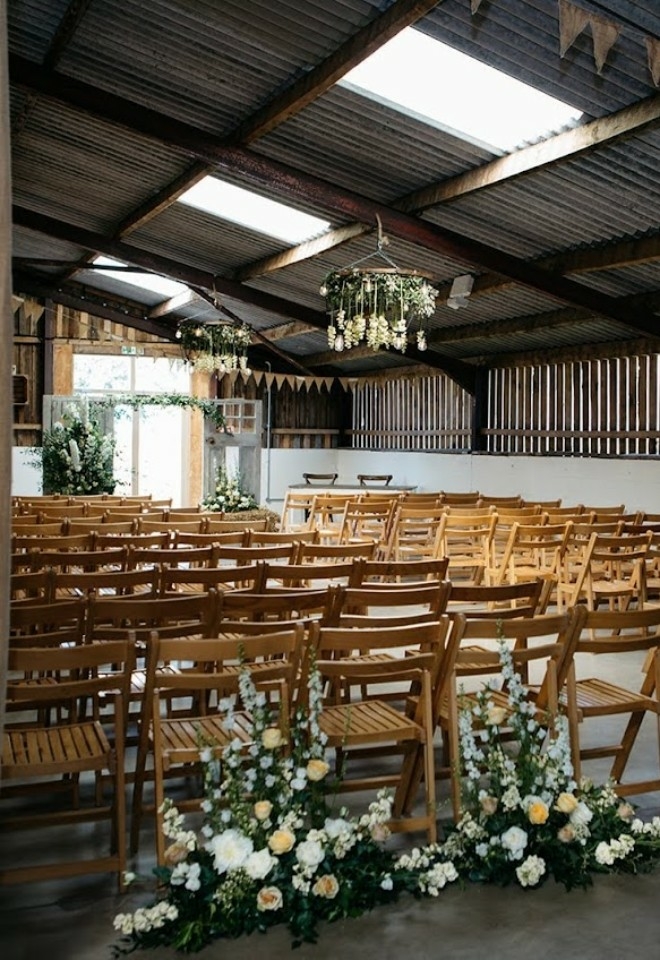 A wedding ceremony inside Grange Barn in Marbury