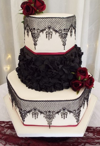 Black & white wedding cake, lace effect, black ruffles and red roses from Gails Cake Pantry Wales