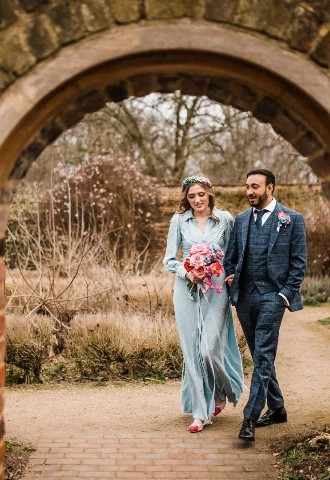 Wedding couple walking through gardens at Valentines Mansion