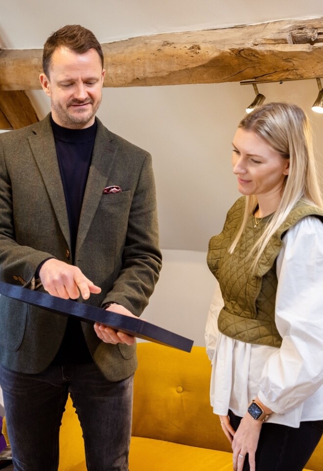 Tom from Lovers rock helping a bride to be find her wedding ring in the showroom