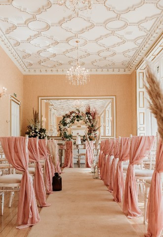Pink themed wedding ceremony at Holmewood Hall, Cambridgeshire