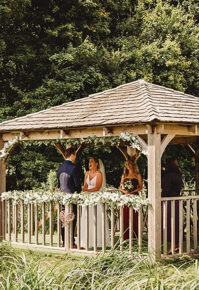 Bride and groom in gazebo