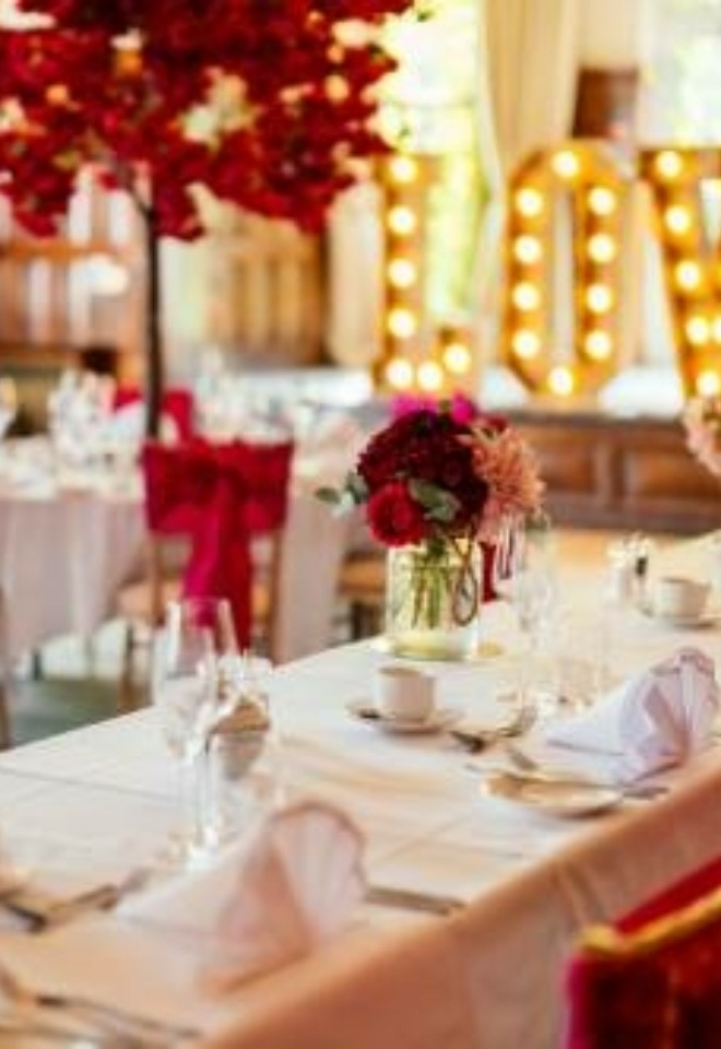View of a wedding breakfast set up from the top table in the Suffolk Suite- Sprowston Manor Norwich