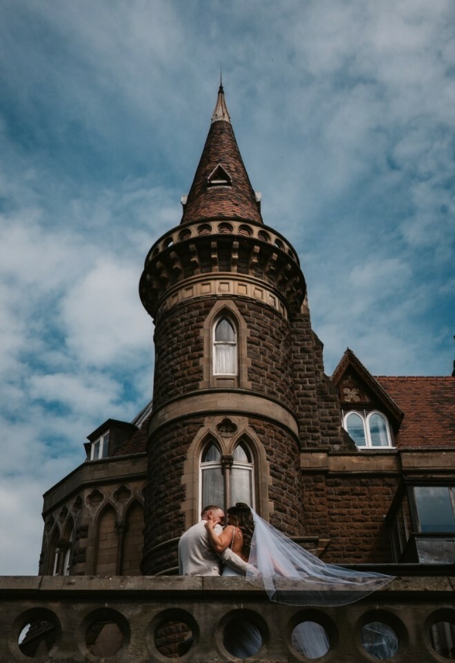 Image of couple in front of turret