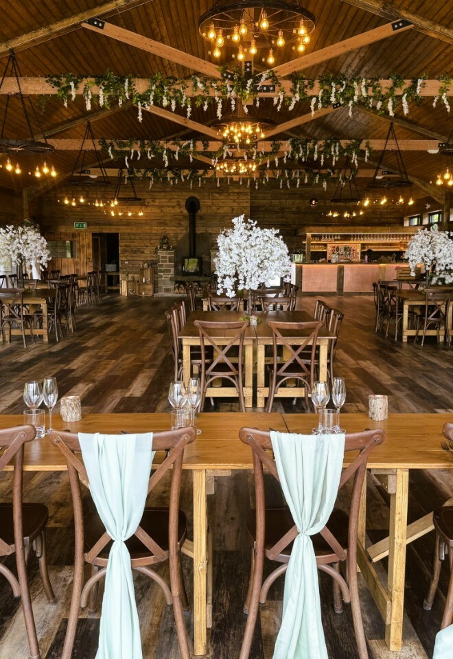  table set up with blossom trees 