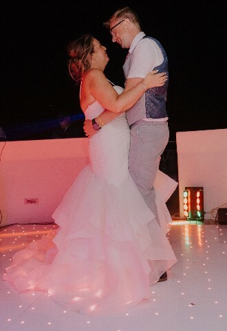 bride and groom share their first dance on a yacht in cyprus