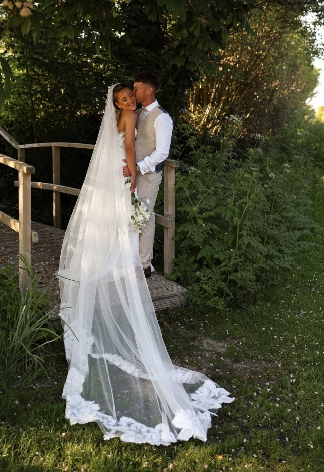 bride & groom on the bridge at Southend Barns, chichester