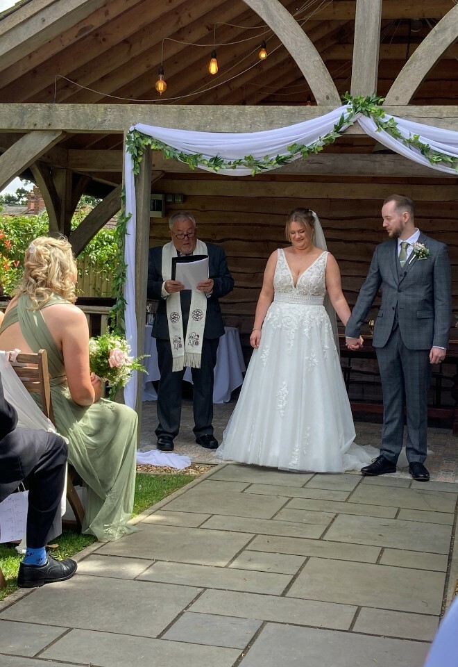 Outdoor wedding ceremony by Trevor English