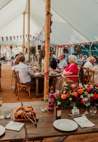 Wedding guests in a marquee at Midelney Manor Wedding Venue Somerset