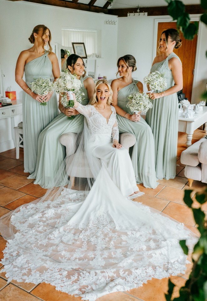 Bride and bridesmaids in dressing room, ready for the ceremony at High House