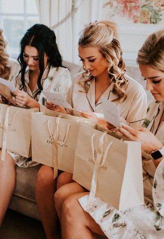 Bridesmaid opening gifts photographed by Gingersnaps Photography Surrey