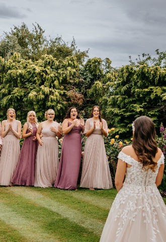 Bride reveal to her bridal party at High House wedding venue in Essex