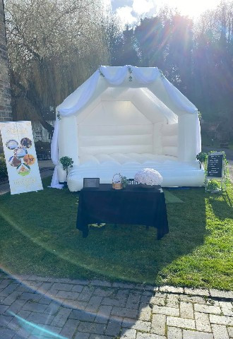 White wedding bouncy castle at The Priests House by the river in Derbyshire