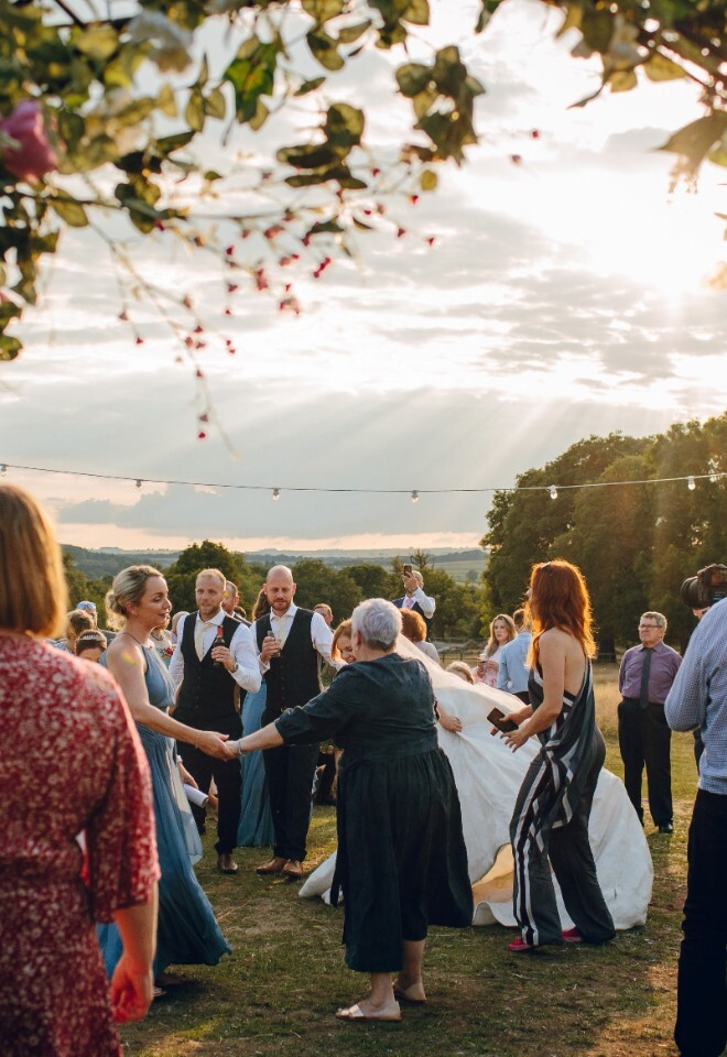 Wedding guests dancing at outdoor wedding venue in Derbyshire