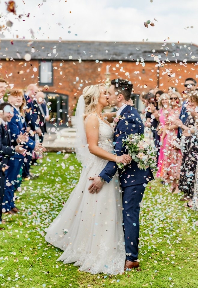 confetti image bride & groom kissing burlton manor weddings shropshire